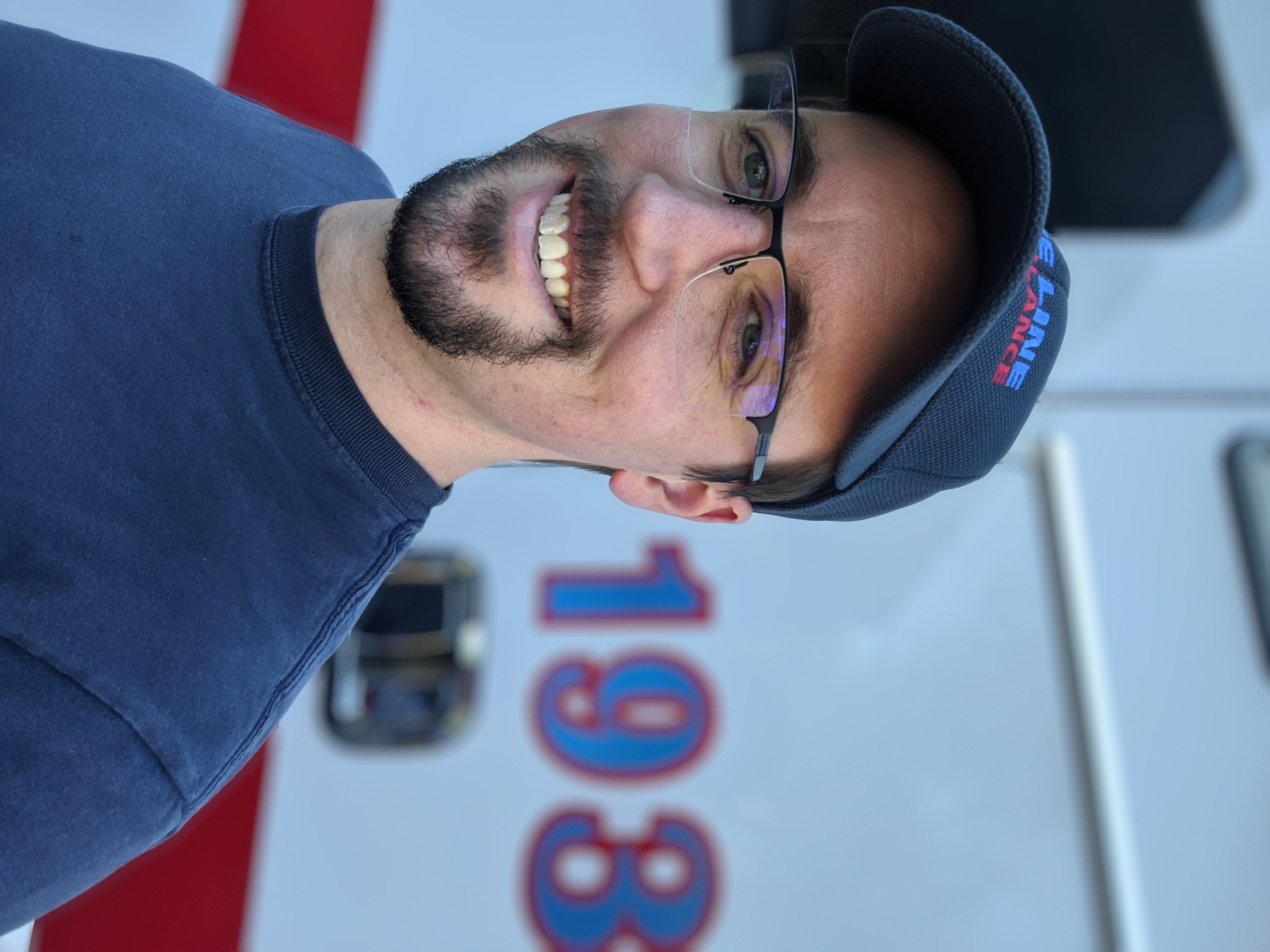 Gavin McGimpsey standing in front of his ambulance.